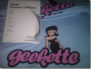 Telerik's geekette shirt with a woman in a fancy dress, leaning on "geekette" in a funky font